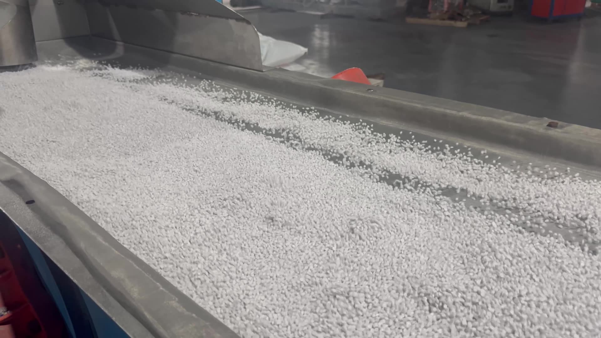 PVC pellets moving through factory equipment